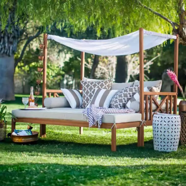 Outdoor Daybeds can be a beautiful place to relax, and don't have to require stock in sunblock cream companies. This daybed has a built-in shade awning!