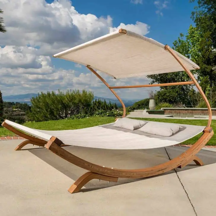 Ultra-modern Outdoor Daybeds like this design with bent wood, sails, and a wide, inviting hammock look like it could be gliding over a glassy lake instead of your back yard!